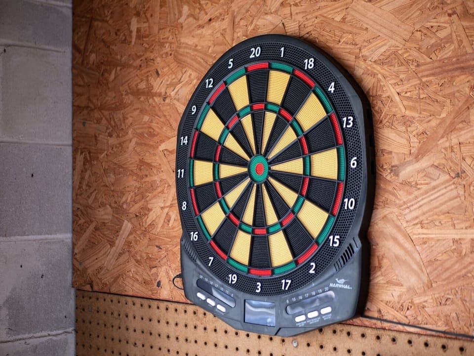 Dart board included