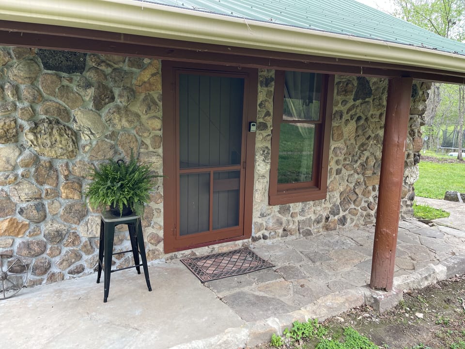 The front porch welcomes you.  With the screen door you can let the air flow.
