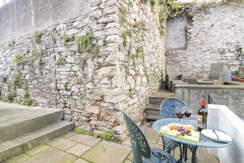 The private courtyard is fully enclosed with old stone walls providing a little haven to sit out in during the warmer months.