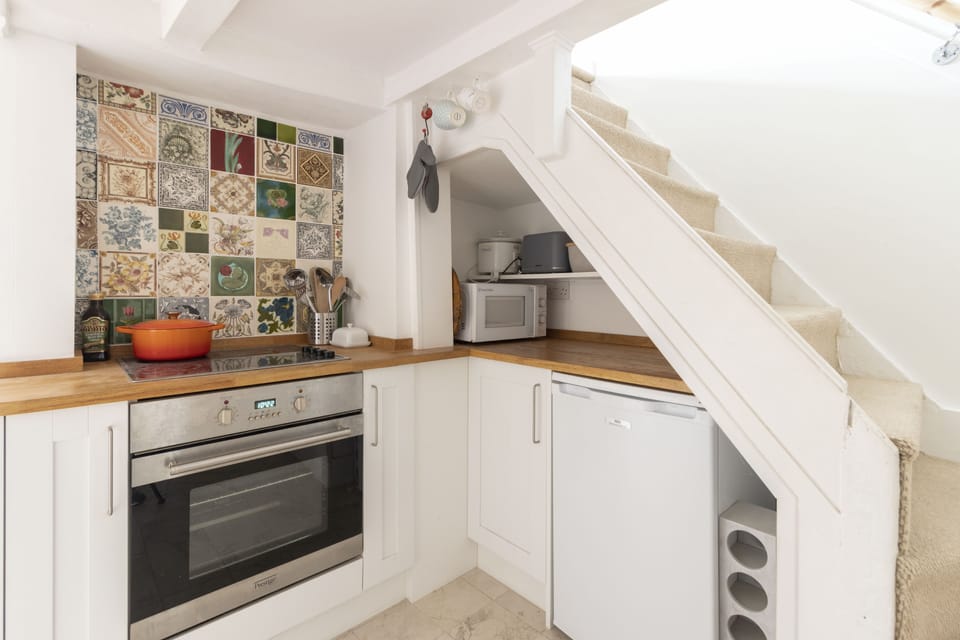 Kitchen and stairs leading up to the first floor