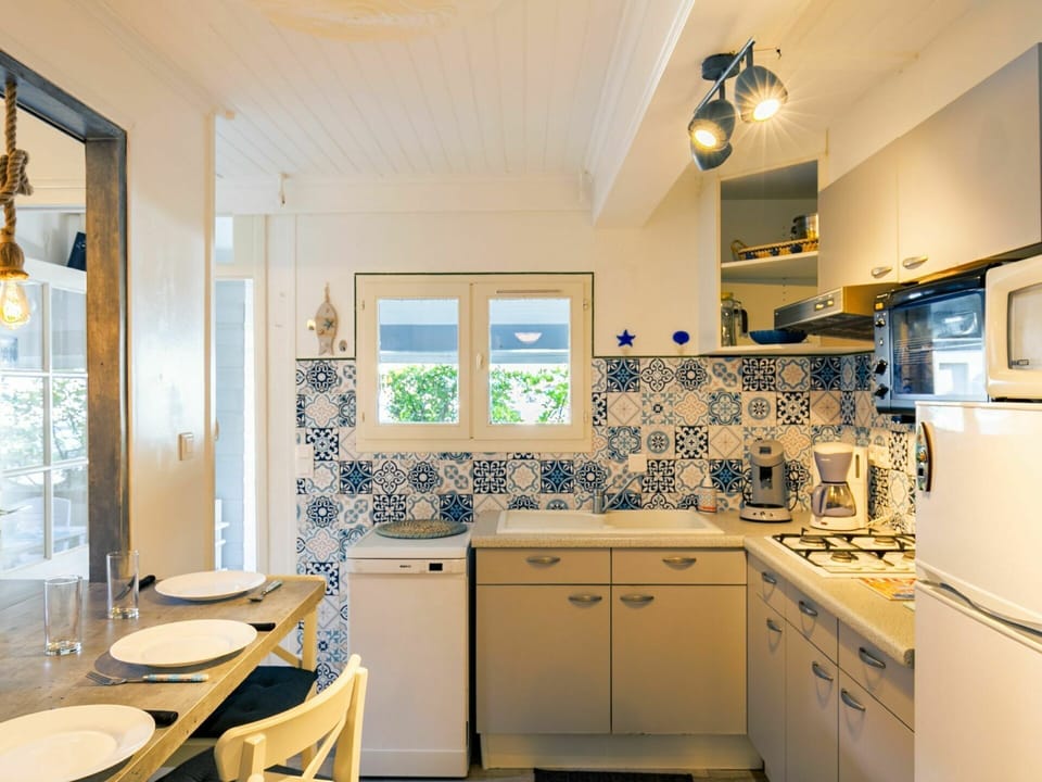 Cabinetry, Building, Property, Countertop, Furniture, Sink, Drawer, Kitchen, Purple, Tap