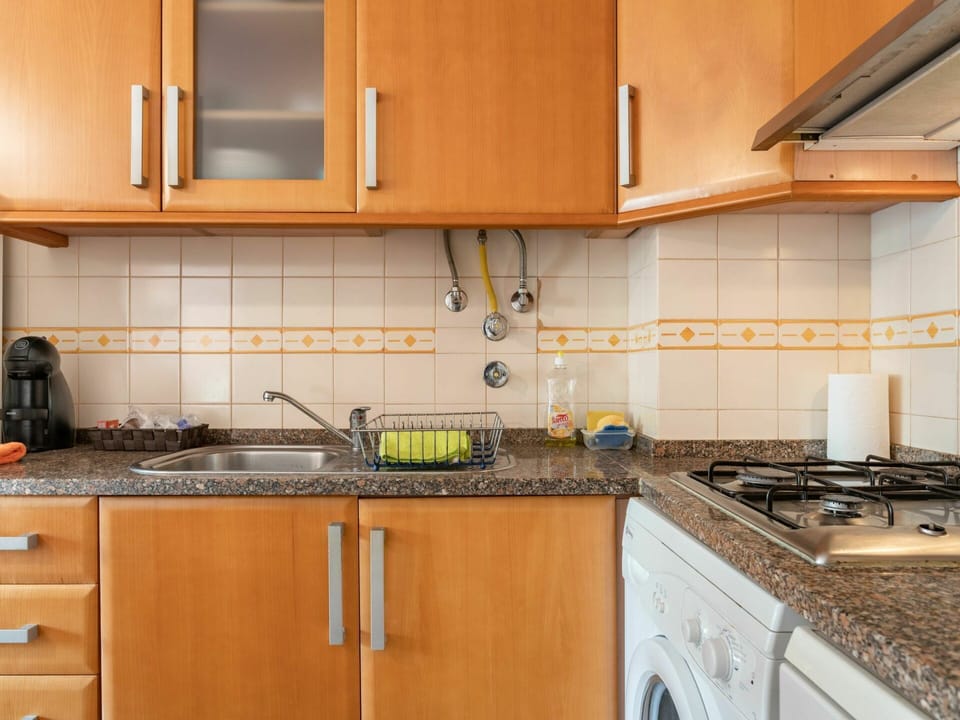 Cabinetry, Countertop, Property, Kitchen Sink, Building, Sink, Kitchen Appliance, Kitchen, Kitchen Stove, Wood
