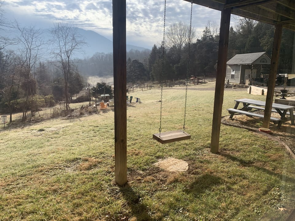 Swing and view from King bedroom window at Wandering Goat Lodge