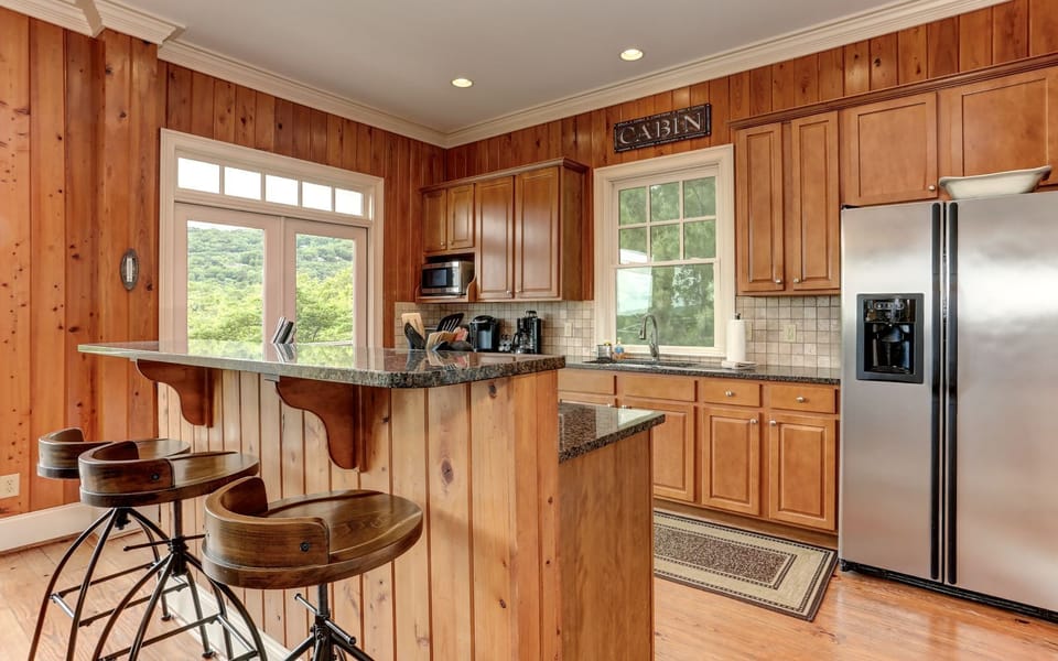 Fully-equipped cabin kitchen - cook up memories in wooded serenity.