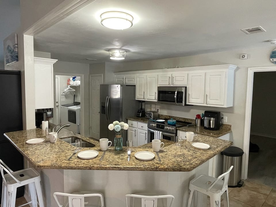 Kitchen and bar top area perfect for your laptop or some breakfast/coffee time