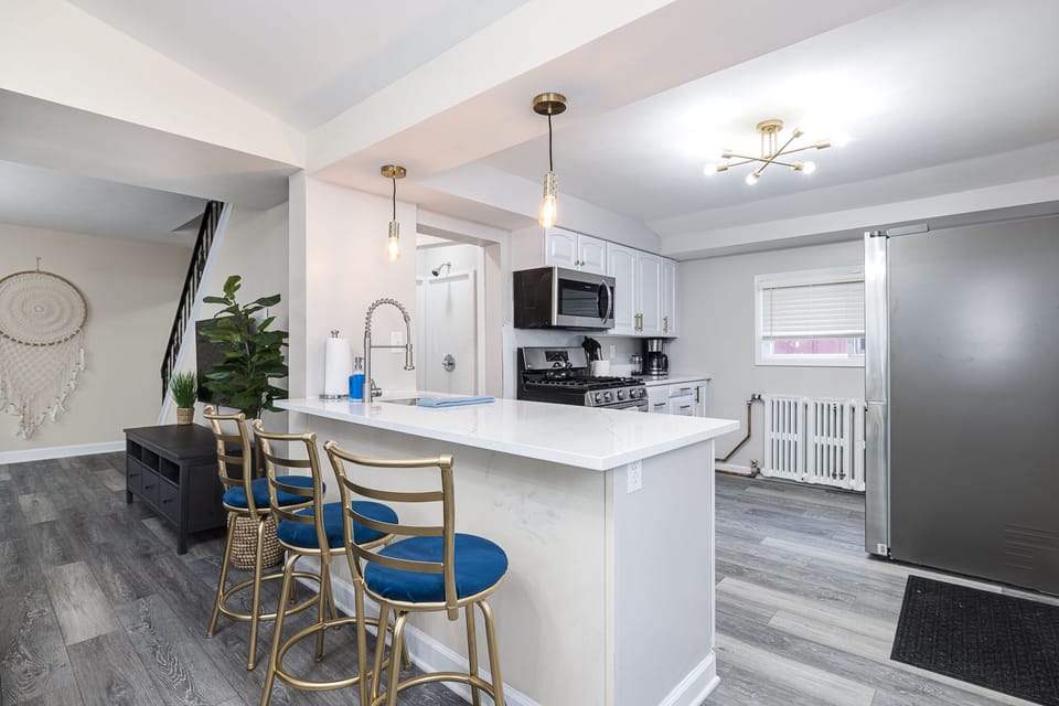 Kitchen with bar seating, new appliances, coffee and coffee maker (12 cup)