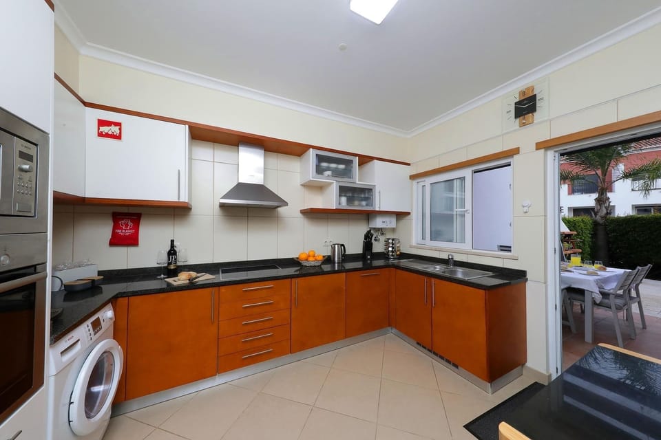 SPACIOUS KITCHEN LEADS TO DINING PATIO