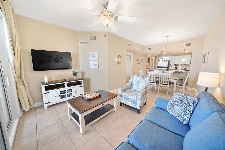 Your bright living space features comfortable seating and seamless flow to the fully equipped kitchen and dining area.