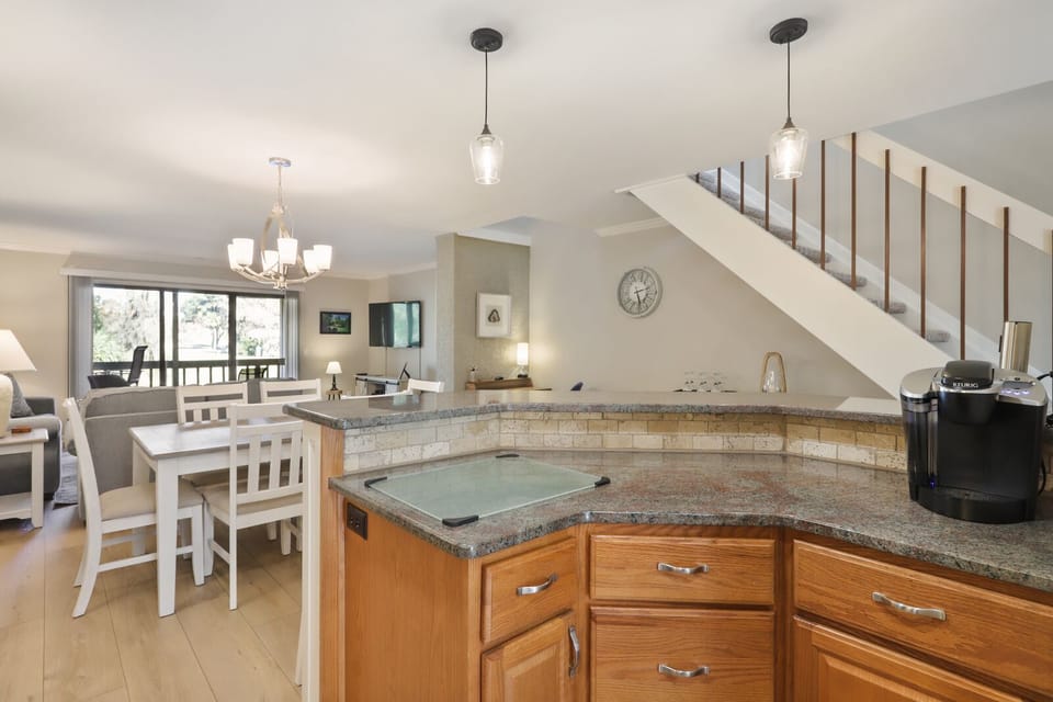 Kitchen with stainless steel appliances and bar stools!