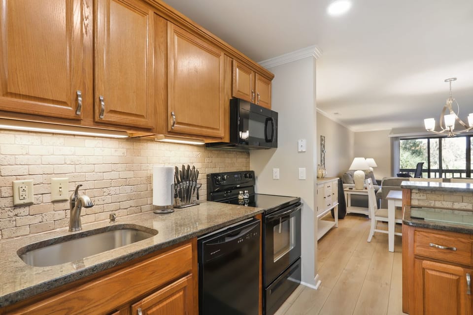 Kitchen with stainless steel appliances and bar stools!