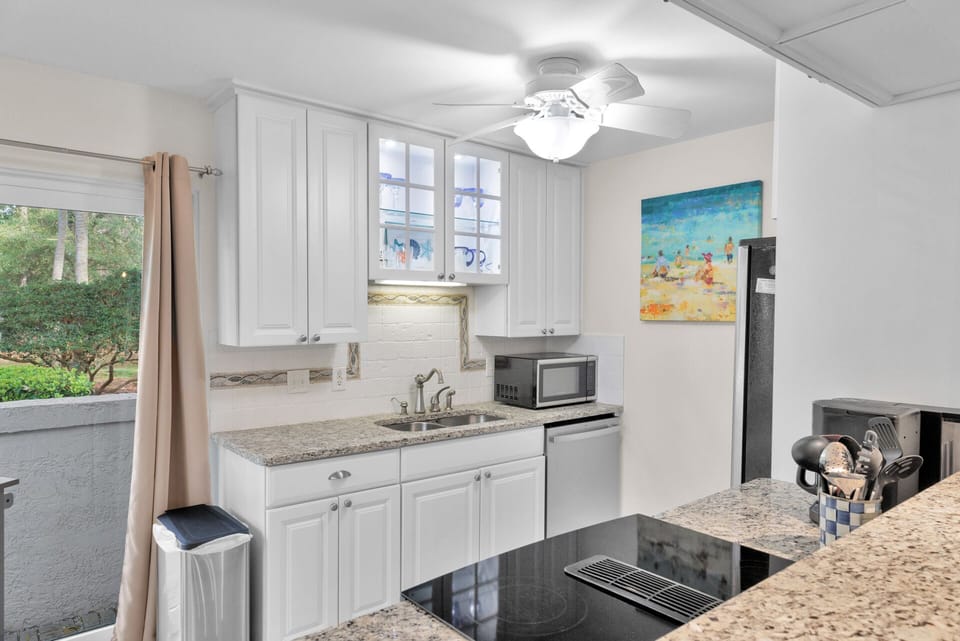Fully stocked kitchen with stainless steel appliances