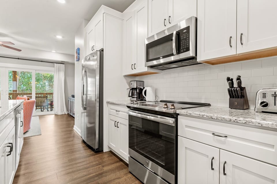 Kitchen with Bar Stool Seating on Second Level