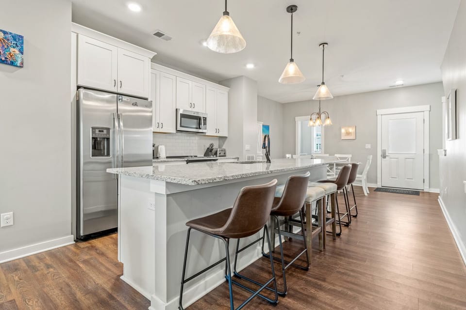 Kitchen with Bar Stool Seating on Second Level