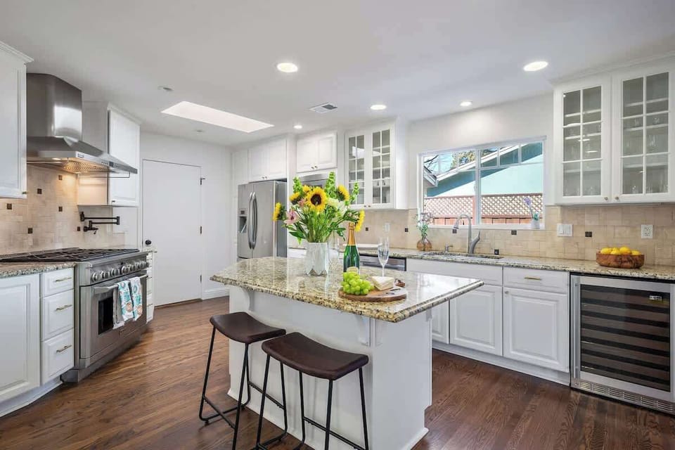 Warm, open kitchen with a welcoming island setup—ideal for morning coffee or preparing meals together.