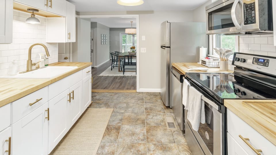 Modern farmhouse galley kitchen looking towards the dining area