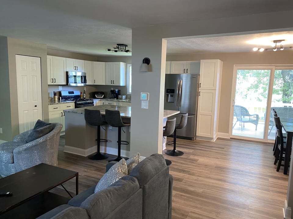 Completely renovated first floor great room with kitchen, dining and family area