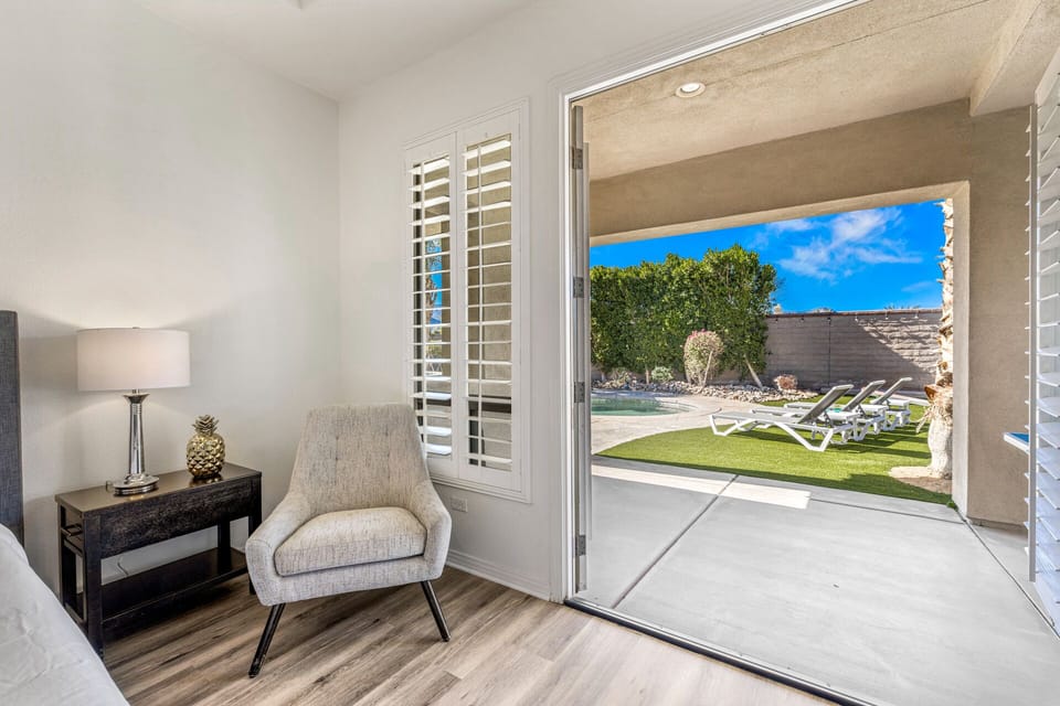 The Primary bedroom also has private double door access to the back patio