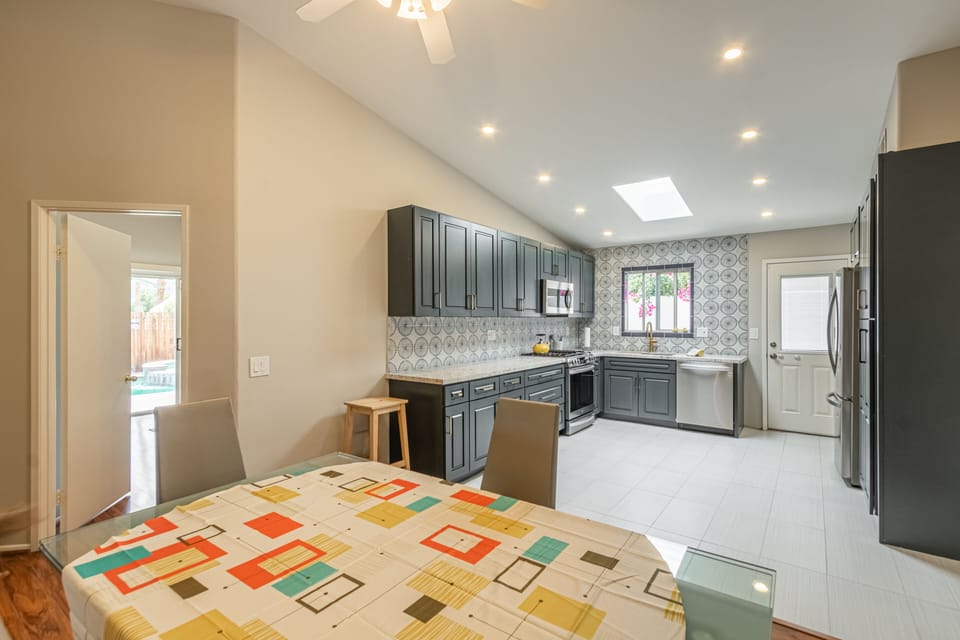 Dinning Area with Expandable Glass Table and seating for six. 