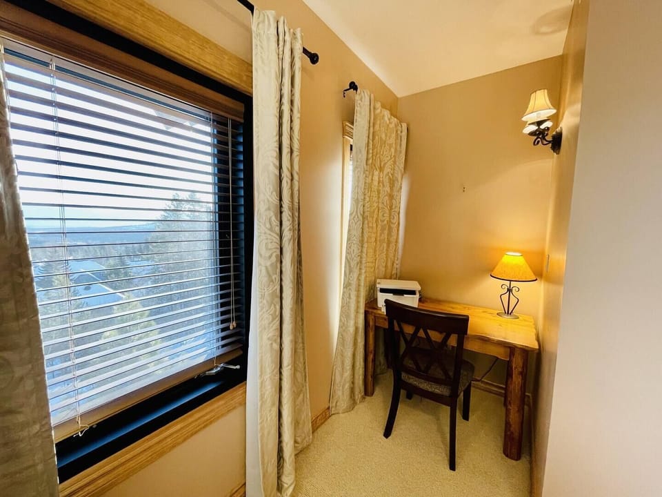 For those times when you just have to do a little work, when on vacation.  Tuck yourself away and have a comfortable place to keep work on track.  A laser printer is provided for your convenience.  Just leave the blinds closed, or you'll not get any 