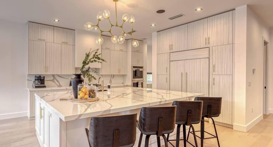 Open Fully Appointed Chef's Kitchen/ Bar Area with high-end appliances. 