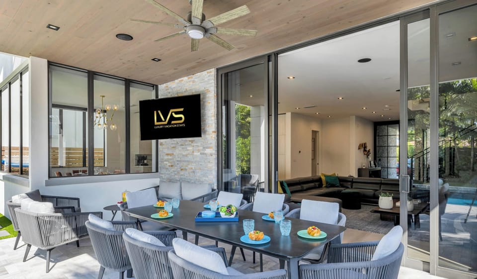 Stunning outdoor space with outdoor TV, Sonos Surround Sound, Built in BBQ, Heated LUXE Pool, Outdoor Dining & More!!