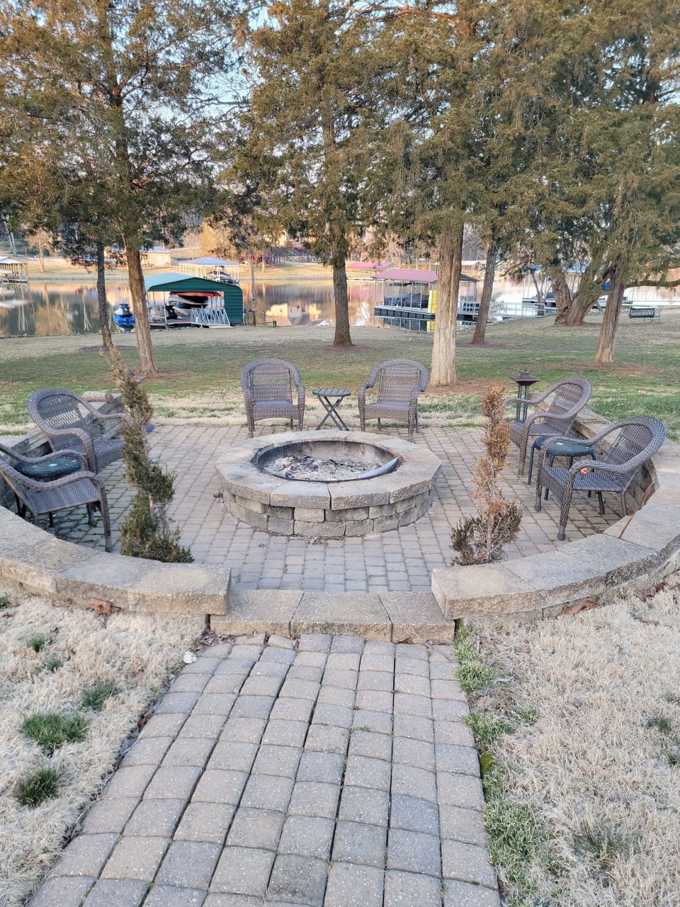 Large firepit area with seating and tables.  