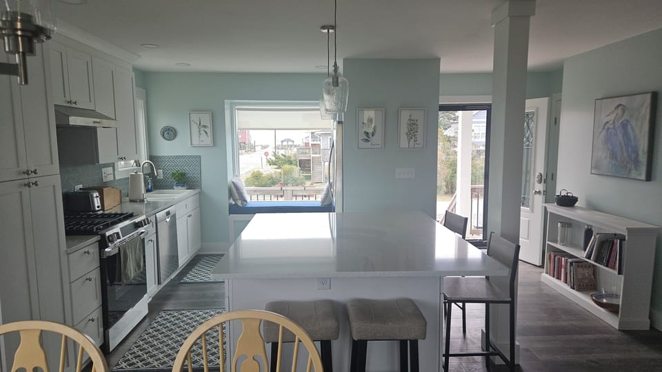 New kitchen in 2026. Quartz countertops, well-equipped. Breakfast bar seats 4.