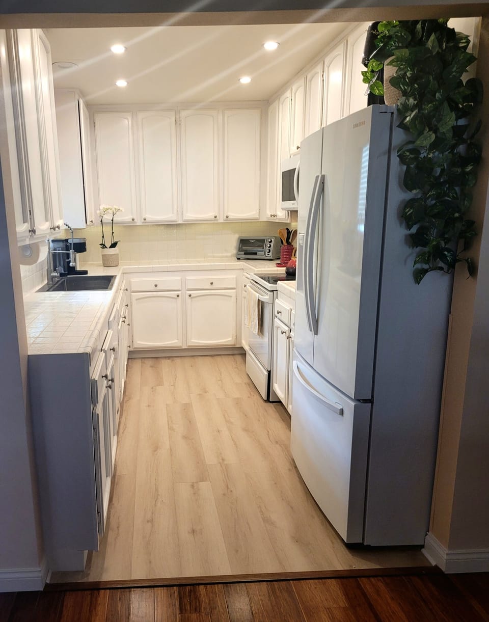 Fully equipped kitchen is light and bright