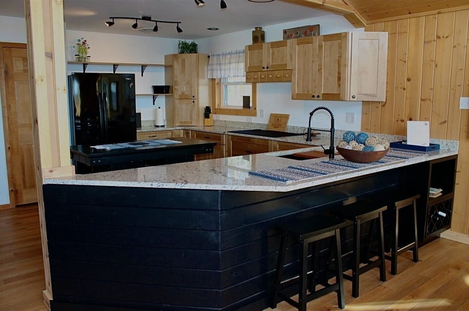 Open kitchen that has stunning views as well.   Everything you need for any meal