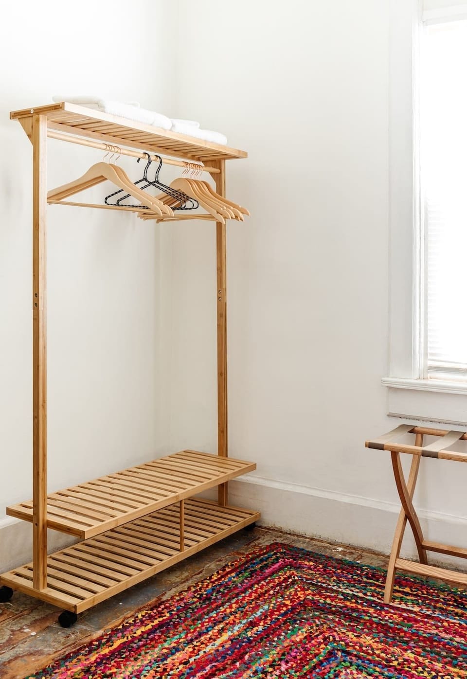Each bedroom features a full closet, bamboo clothing racks, and a luggage stand.