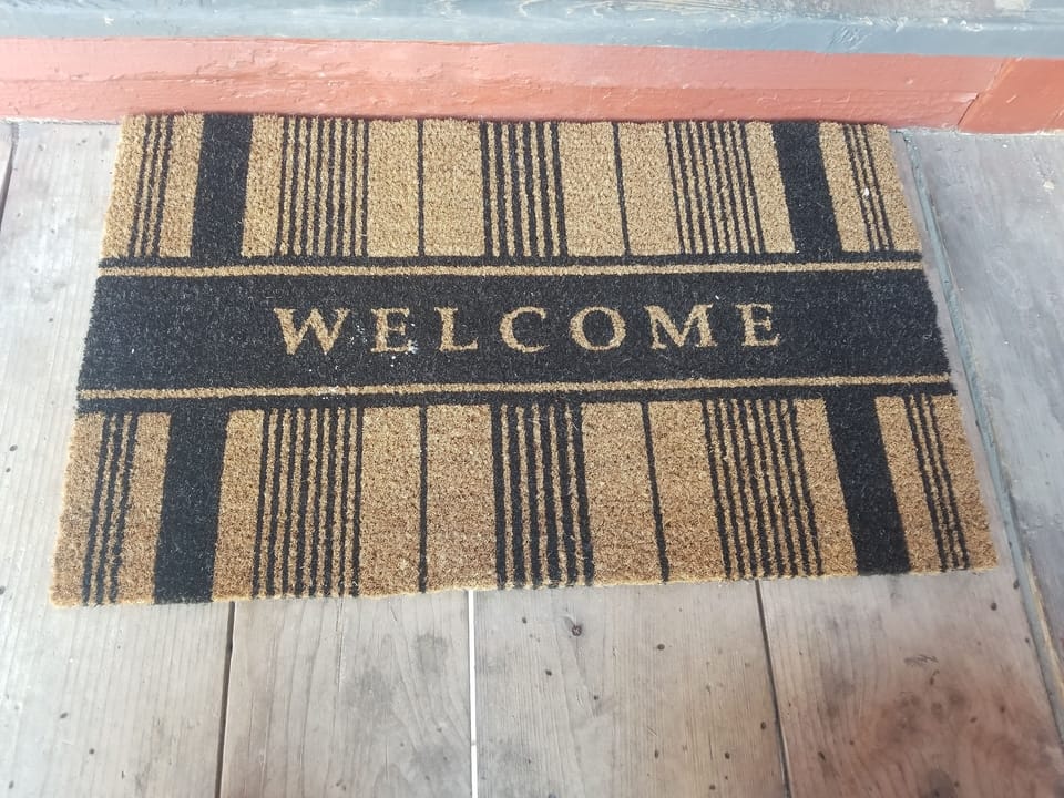 Front door at top of stairs