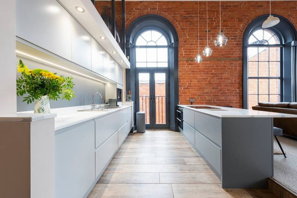 Luxuriously furnished self-catering apartment, modern kitchen complete with in-built appliances and hidden drawers.