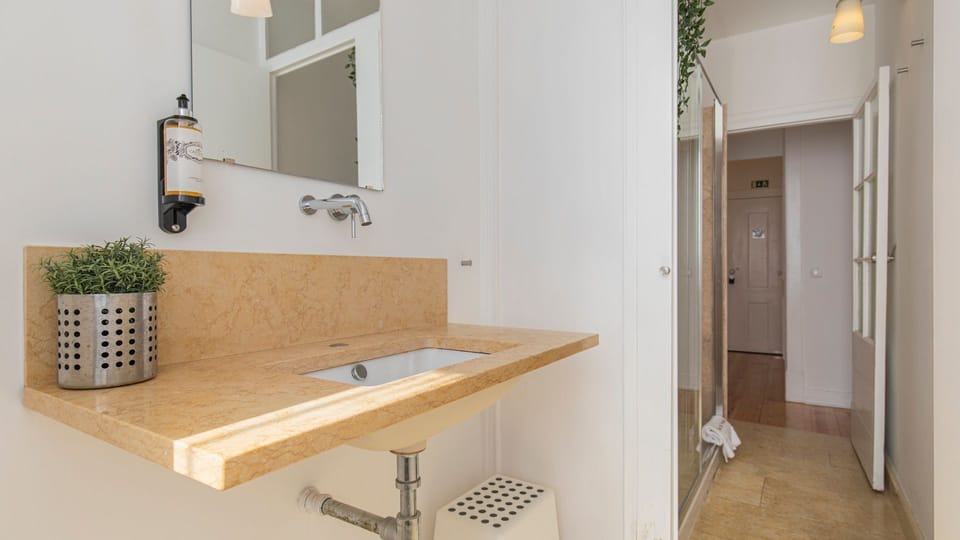 Spacious bathroom with a shower #bright