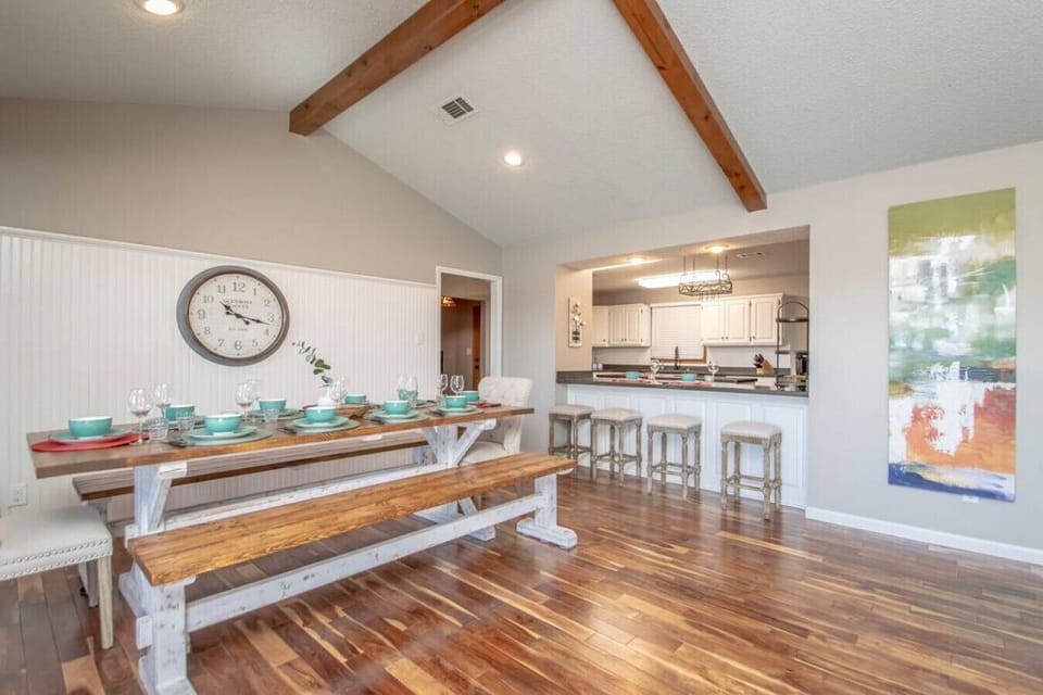 The 8 foot Farm House table seats 10 and there are 4 more spaces right at the bar.