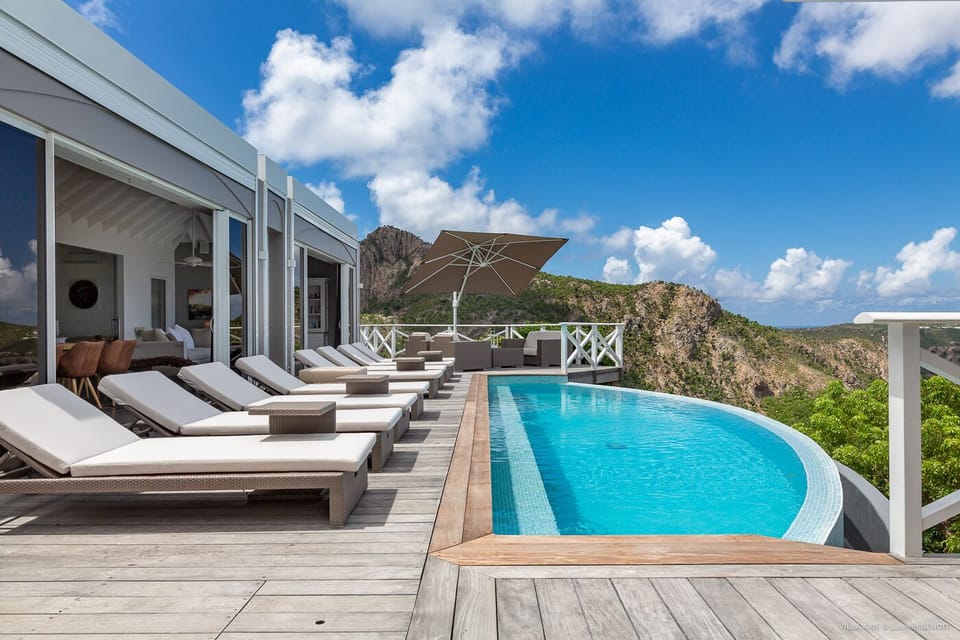 Terrace & Pool: Large teak terrace with heated overflow pool with stairs and view to the west