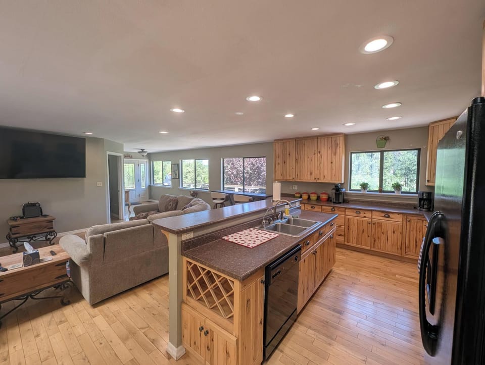 Well stocked kitchen and open floor plan perfect for entertaining.
