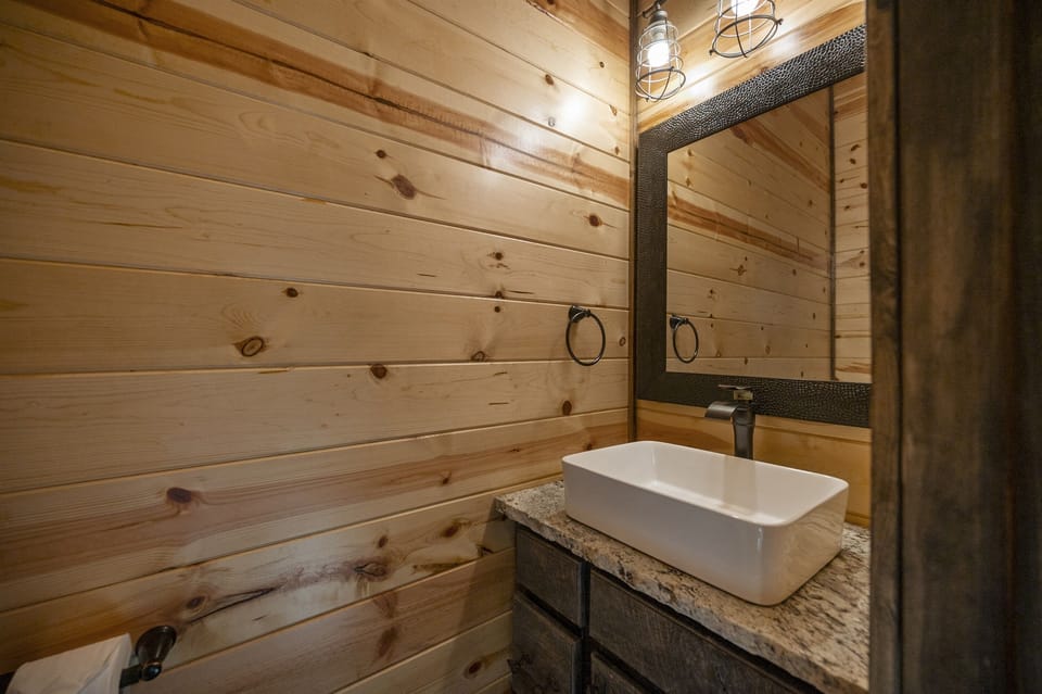 Half bath located downstairs next to kitchen
