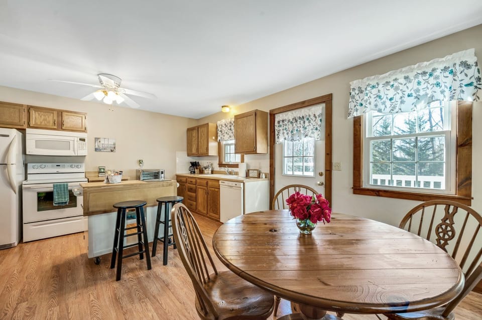 Full kitchen with island seating and expandable kitchen table