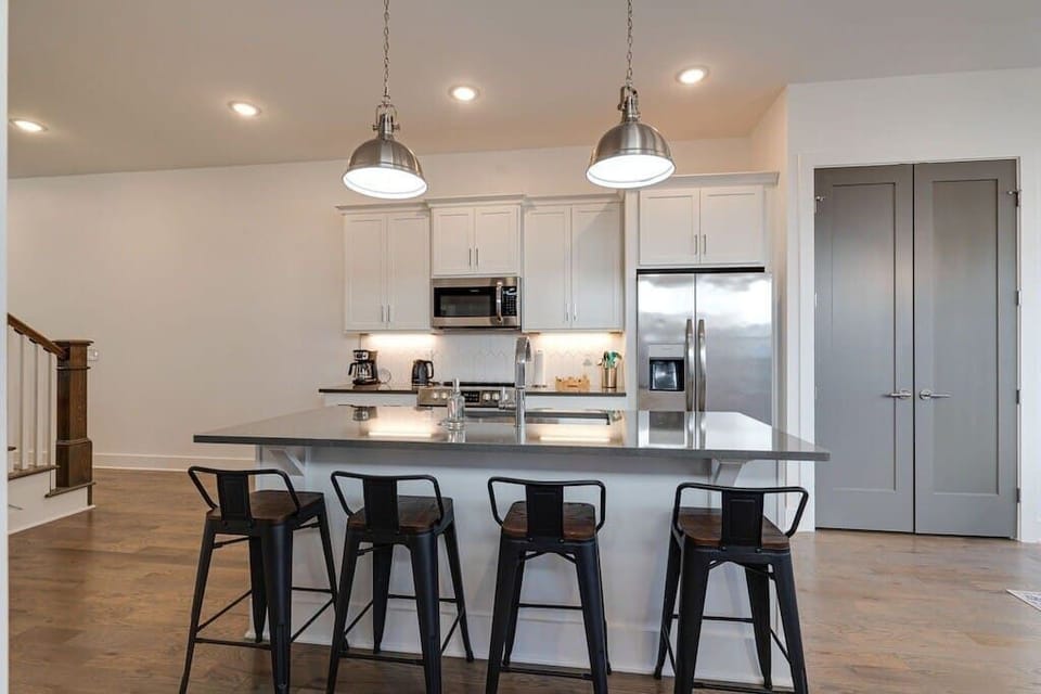 Bar seating allows the whole group to gather together in the kitchen