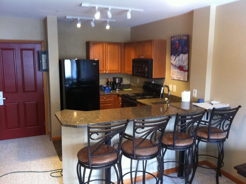 High top bar stools for eating around the kitchen.
