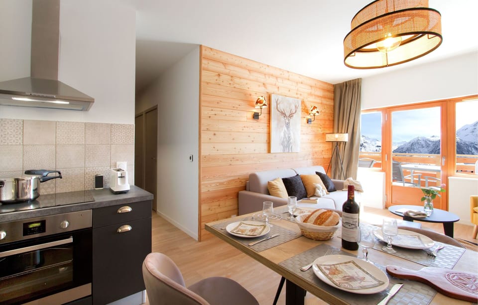 Unwind in the bright living area. Views vary!