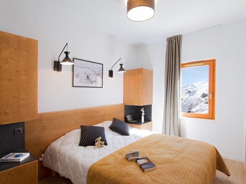 Relax on the comfy bed after a day outside.