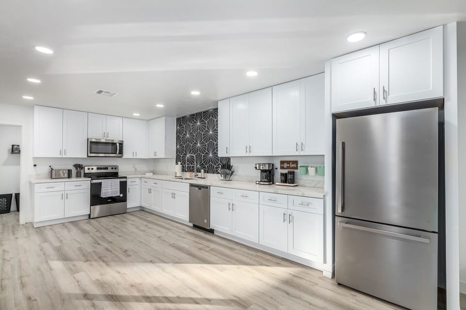 Large kitchen with stainless steel appliances