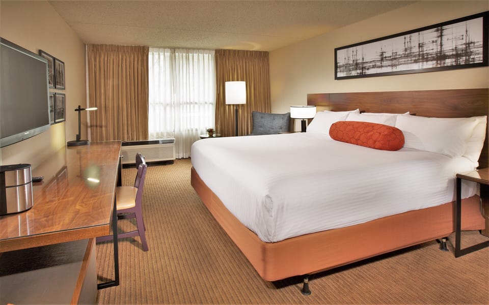 Unwind in a spacious king room with dedicated work desk.