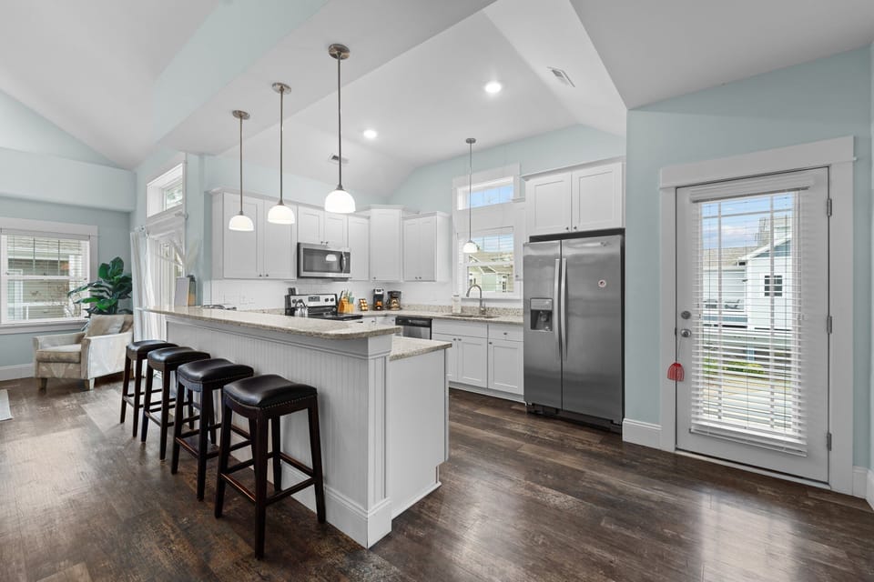 Kitchen with Bar Stool Seating on Second Level