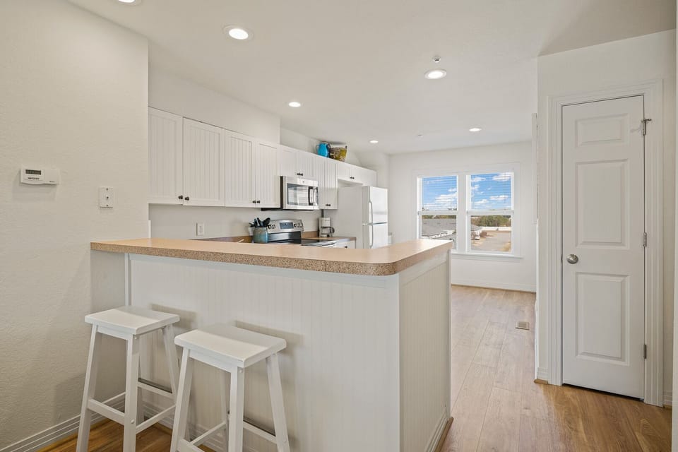 Kitchen with Bar Seating on Third Level
