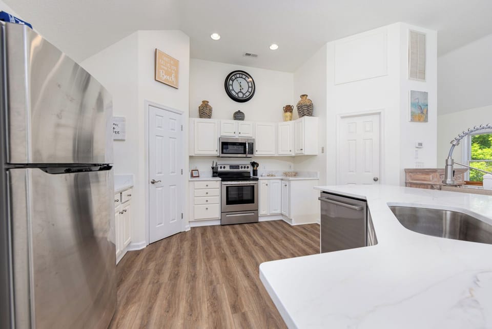 Kitchen Area with Bar Seating on Third Level