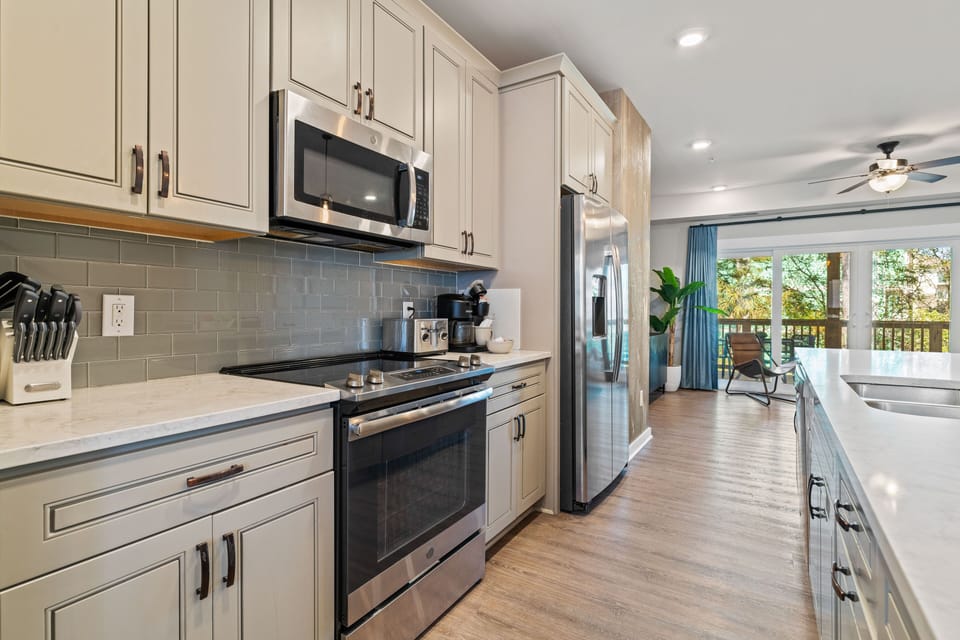 Kitchen Area with Bar Seating on Second Level