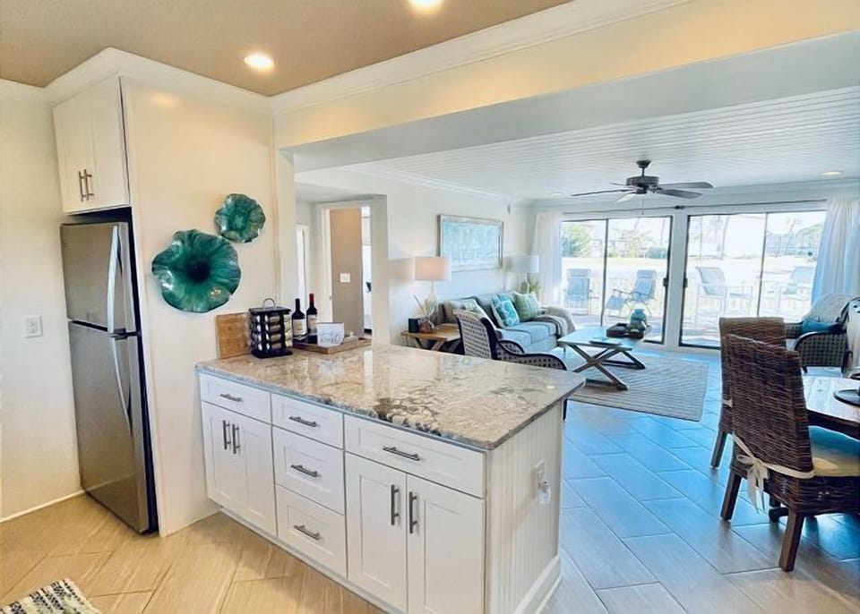 You'll love the open-concept design where your fully equipped kitchen flows seamlessly into the bright living space, perfect for gathering with loved ones.