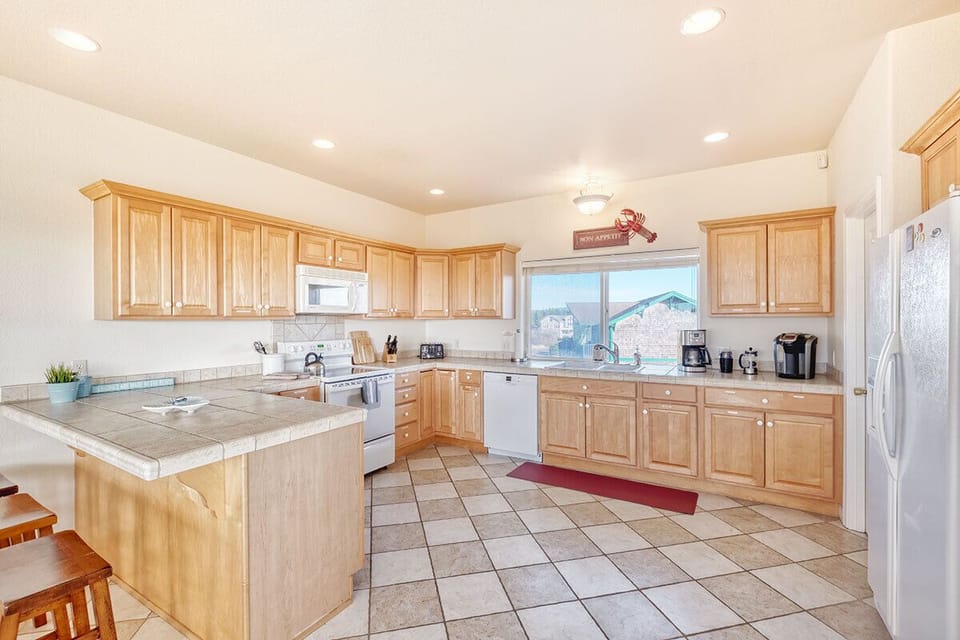 Ocean View B - Spacious kitchen stocked with everything you need to cook with, just bring your food!